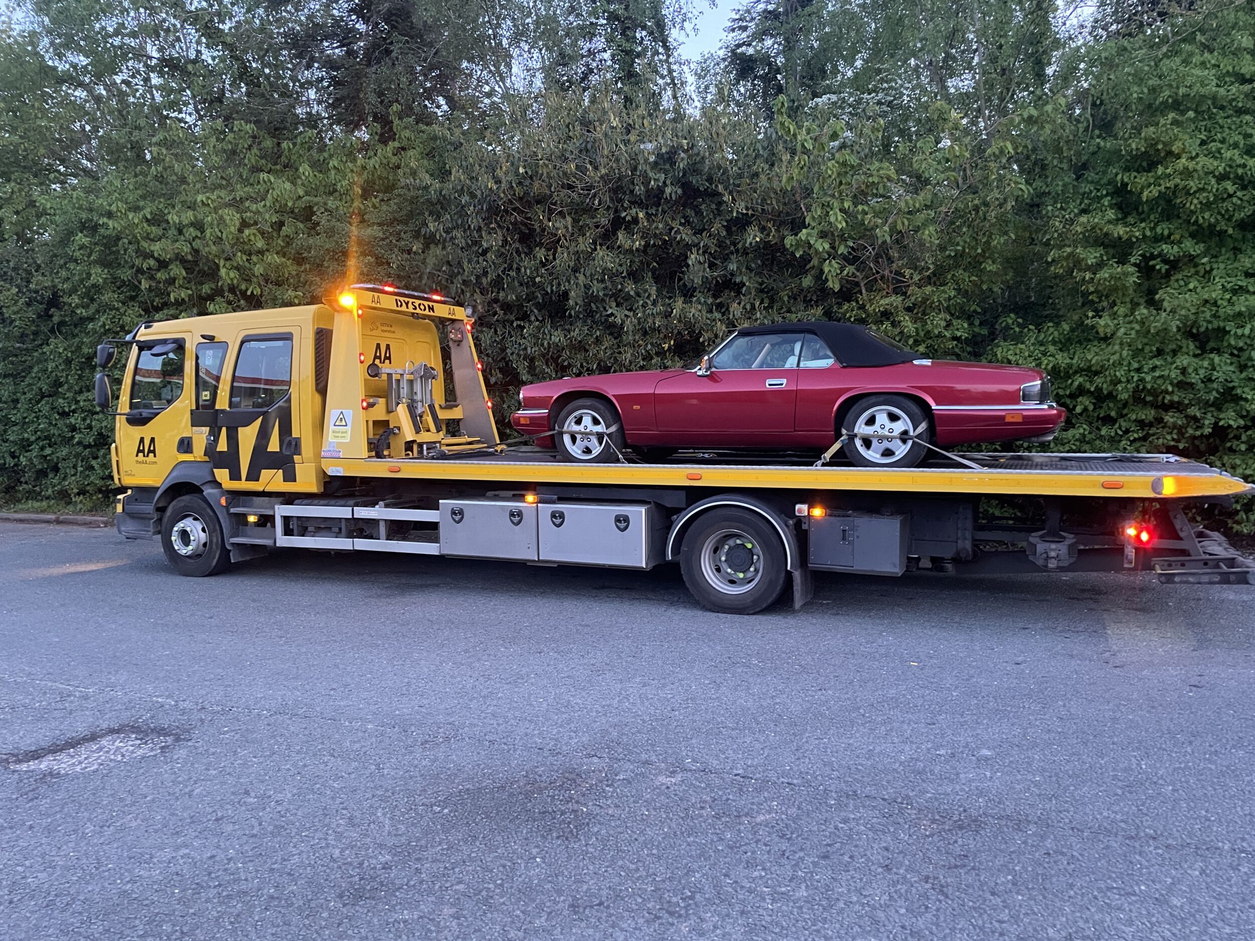 XJS Convertible on recovery transporter after fuel pump failure